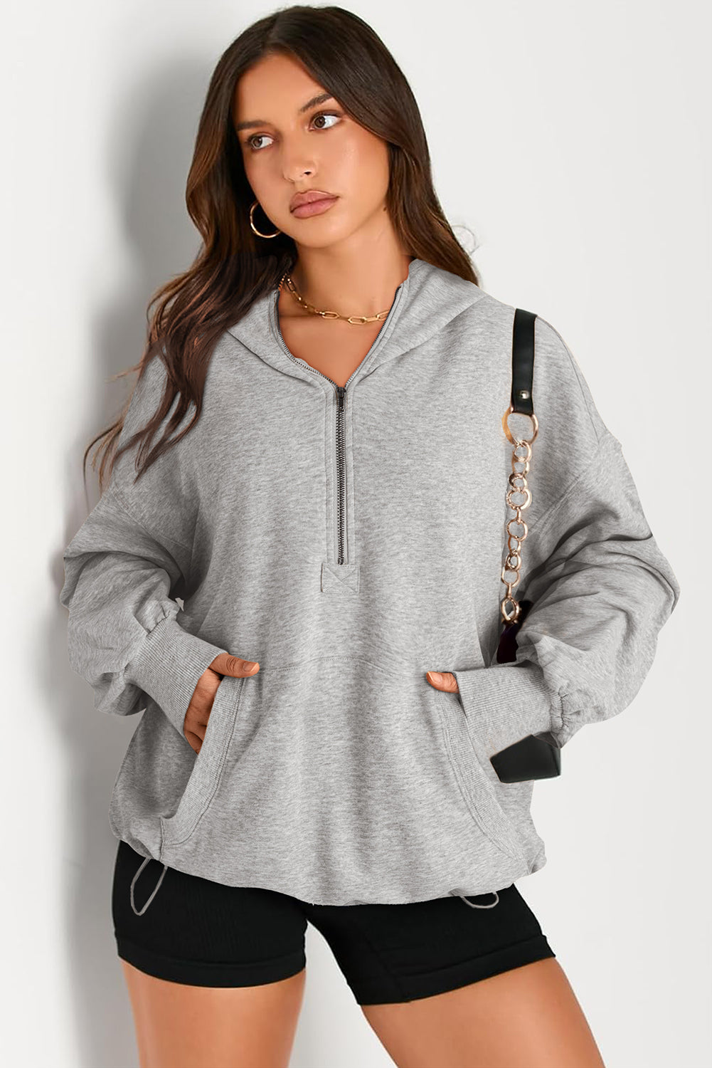 Sweat à capuche à manches longues et demi-zip avec poches