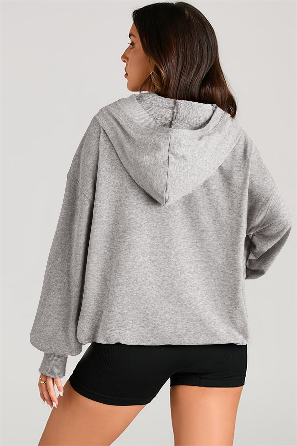 Sweat à capuche à manches longues et demi-zip avec poches